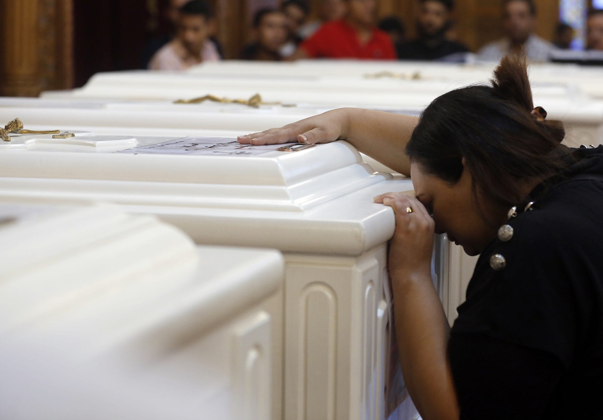 Christians in Egypt prepare to bury their dead after attack
