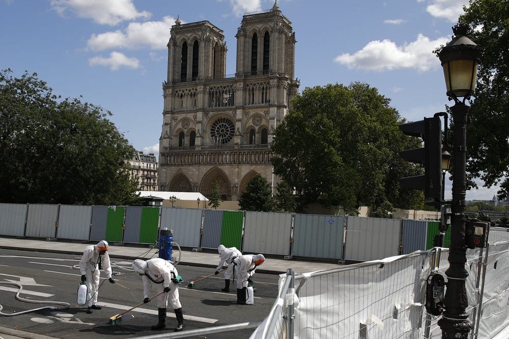 Lead scrubbed from Paris streets as Notre Dame work resumes