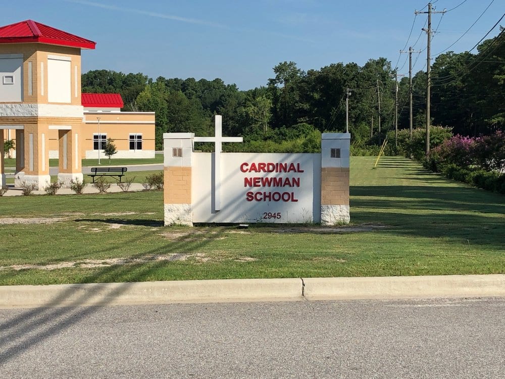 Catholic school gets new slogan after racist videos, threat