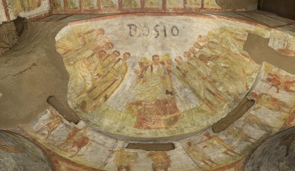 Room of the Bakers in the catacombs of Domitilla, Rome. Above the figure of Christ the name 'Bosio' is clearly written. (Credit: Pontifical Commission of Sacred Art.)