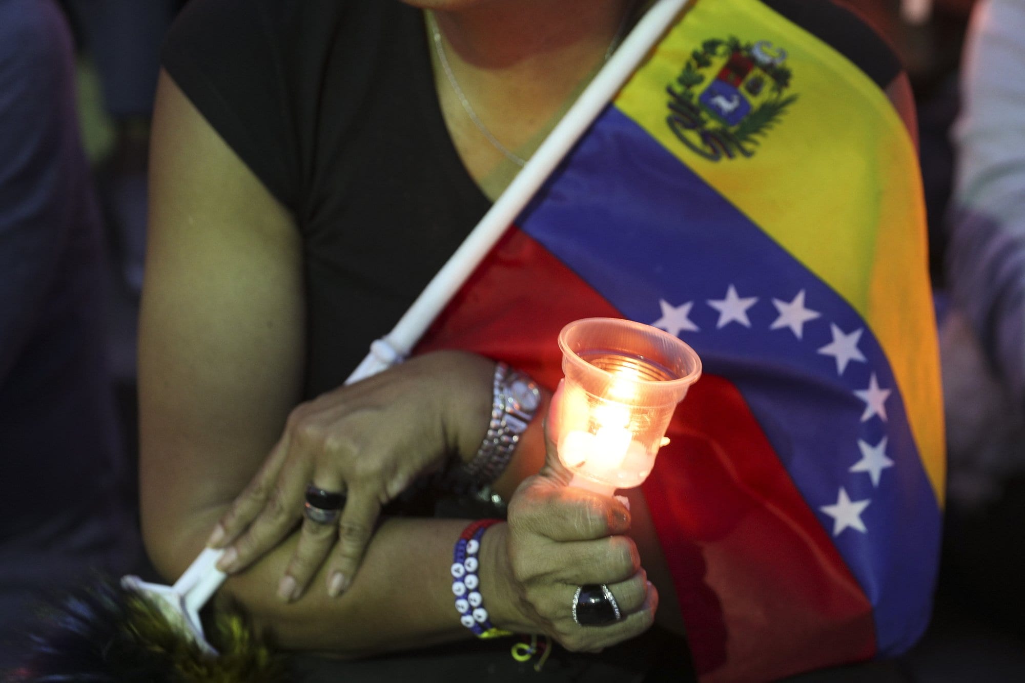 Venezuelans hold vigil for those killed in street clashes