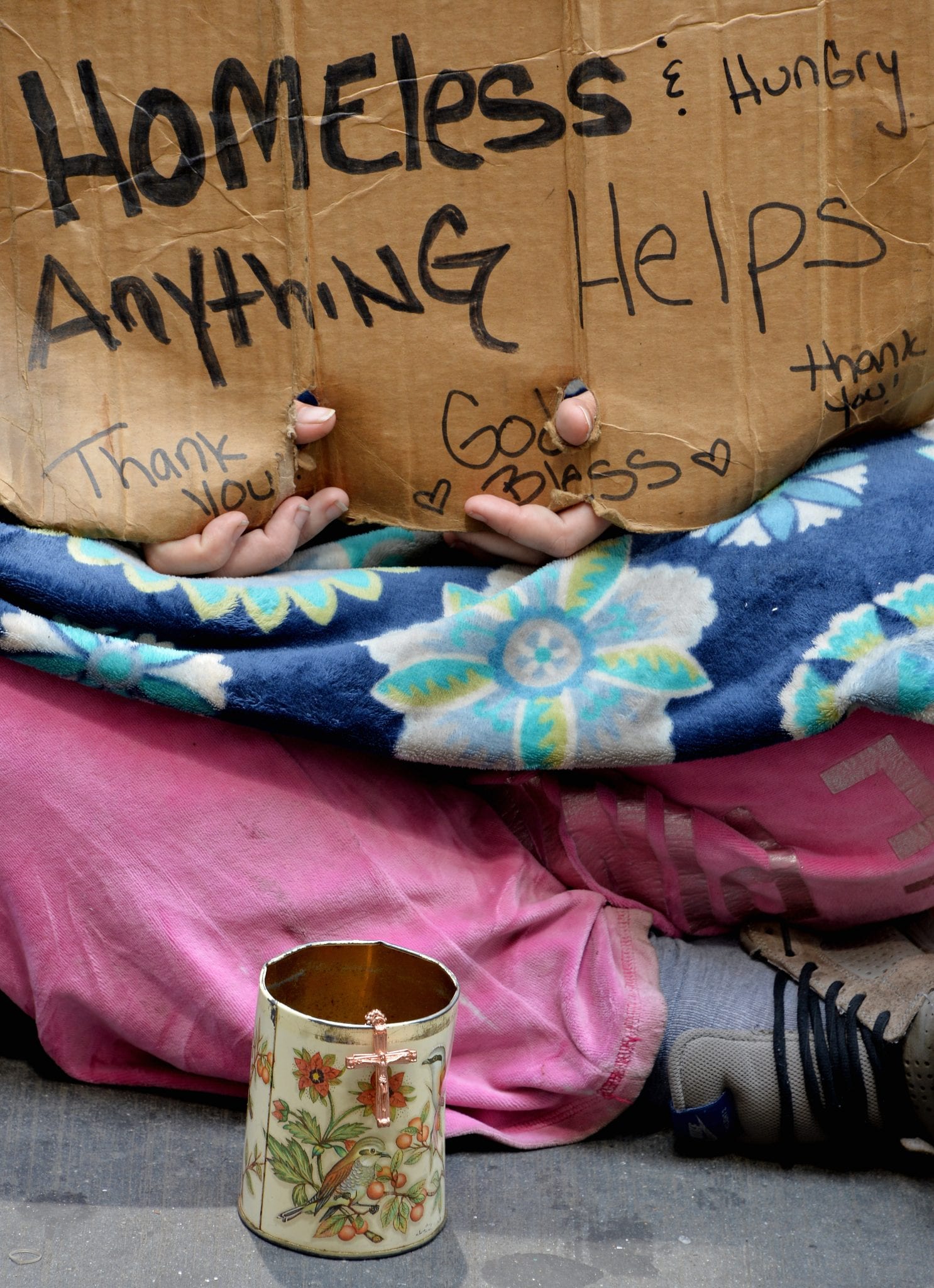 After Pope OKs giving to beggars, U.S. bishop says not to