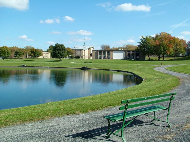 Buffalo seminary professor charged with threatening reporter