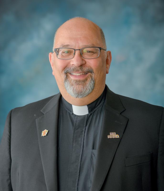 Priest’s routine is now COVID patients, outdoor confessions, online Masses