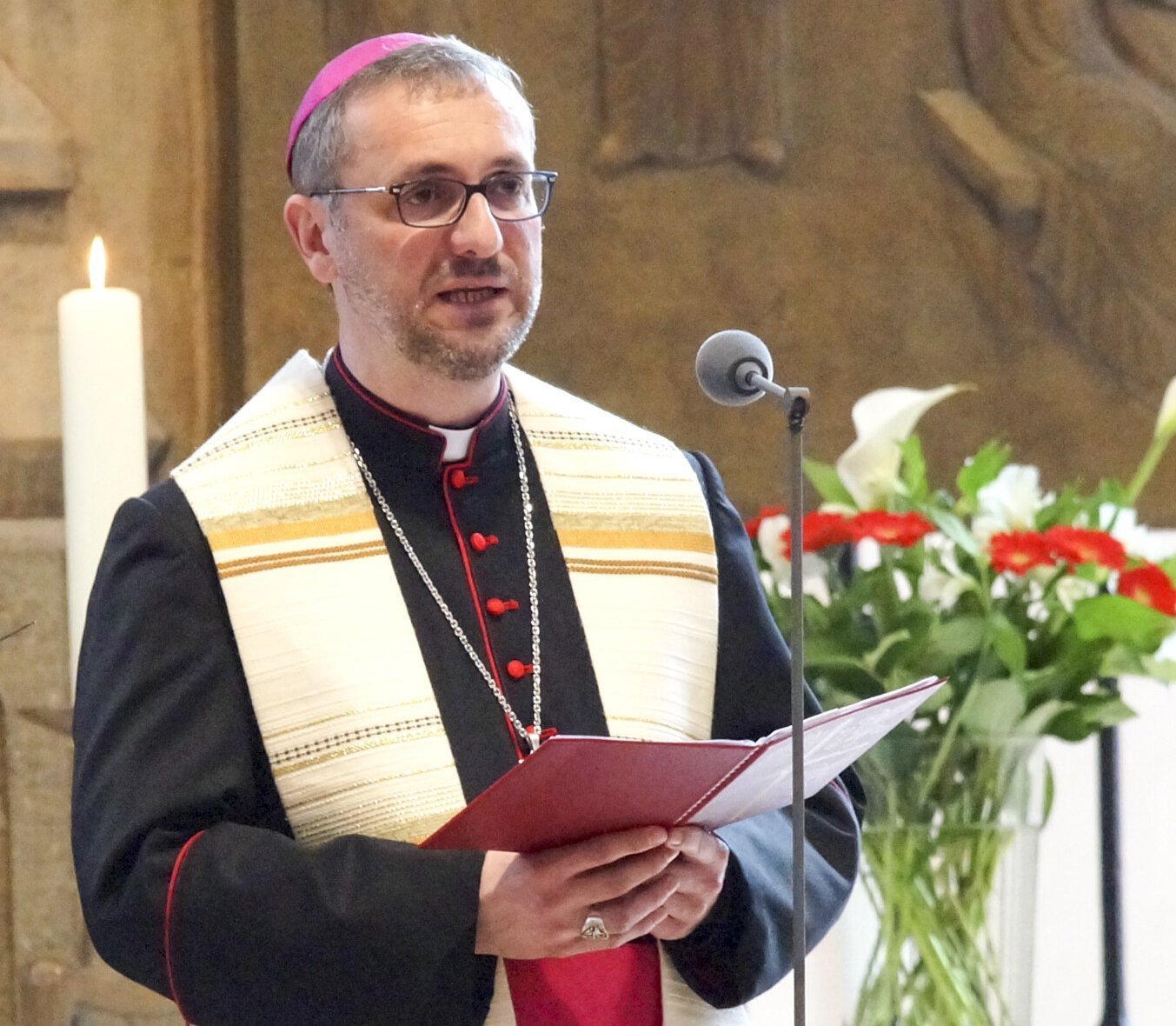 Amid cover-up allegations, German prelate steps down from lay organization
