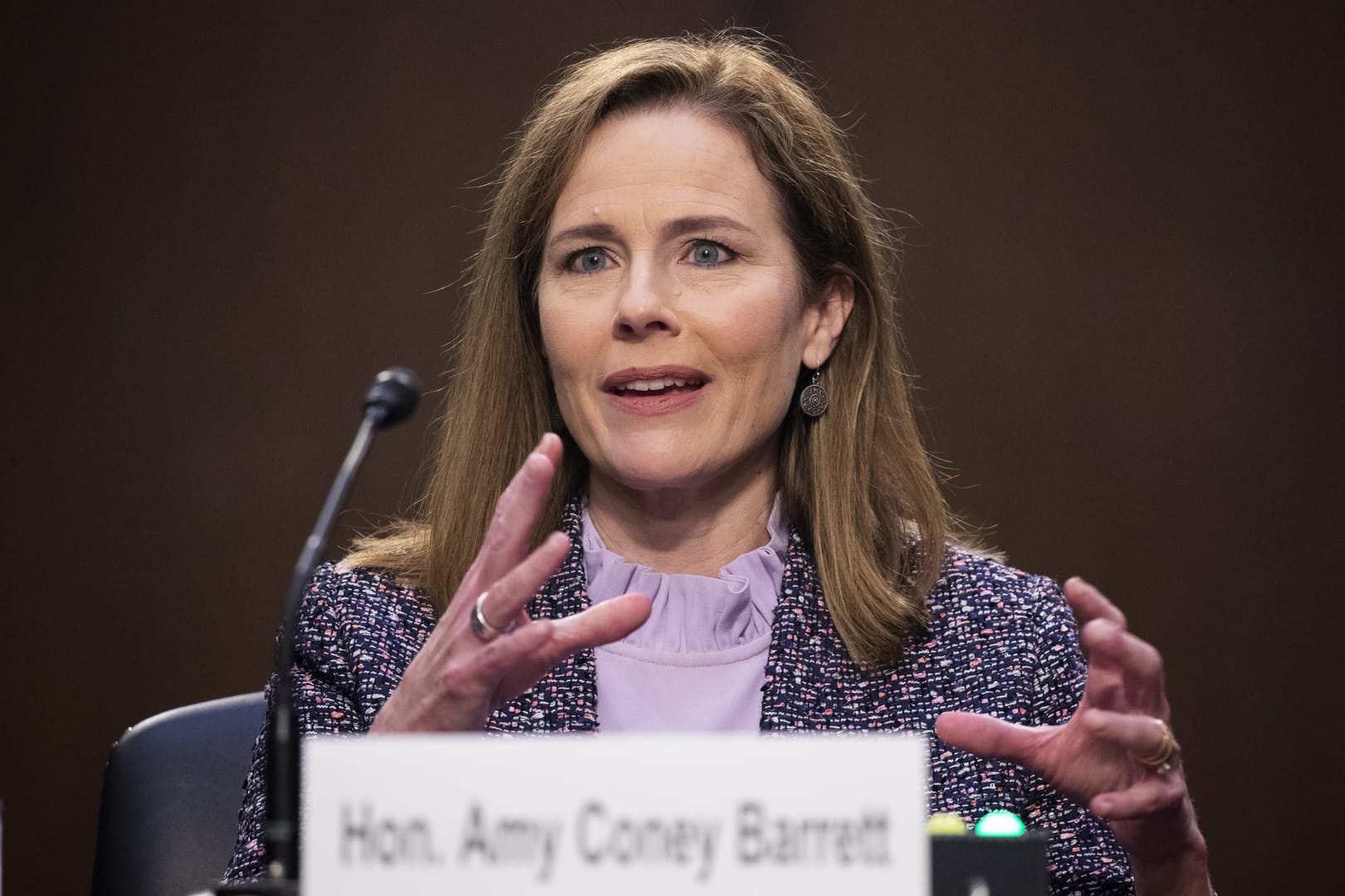 Barrett tells doubtful Dems she’d keep open mind on court