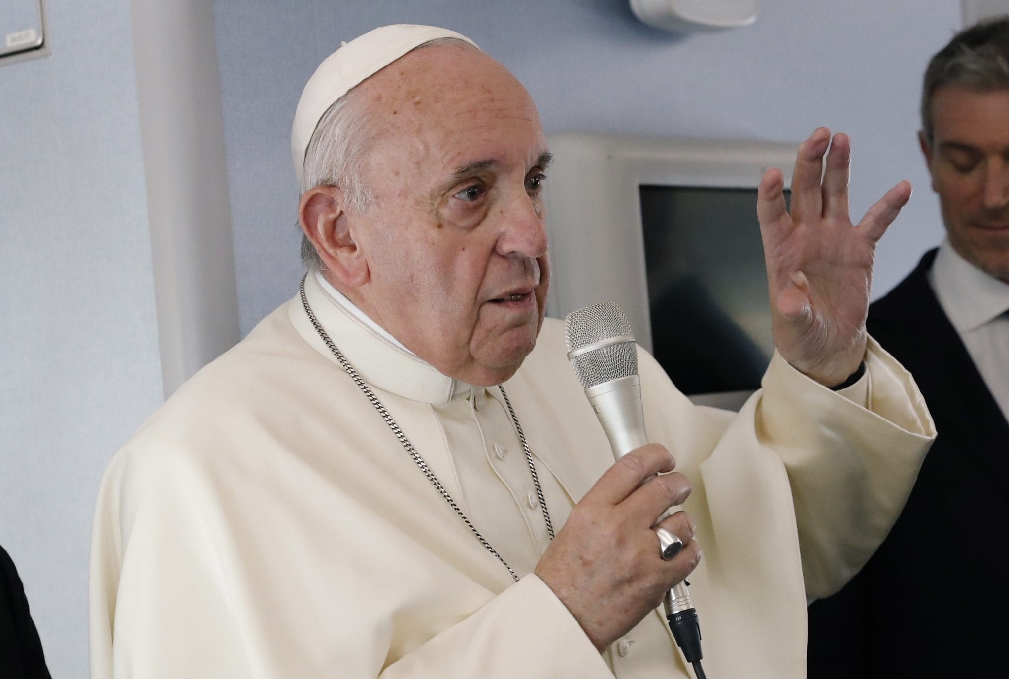 Pope says financial reforms are working, wants anti-nuke stance in catechism