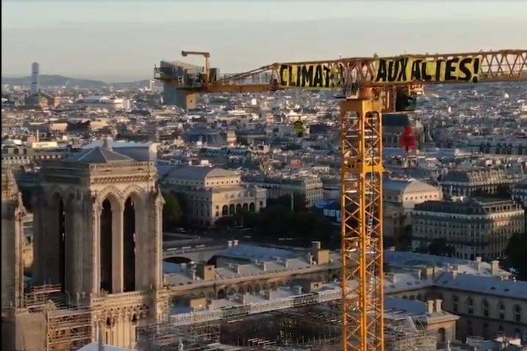 Climate activists protest from Notre Dame Cathedral crane