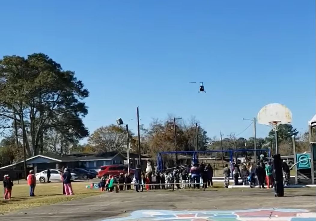 Reward for good schoolkids: Helicopter-dropped treats