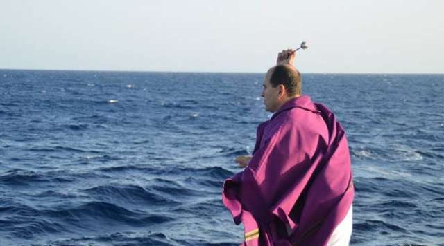 Meet the priest who helped rescue thousands on the Mediterranean Sea