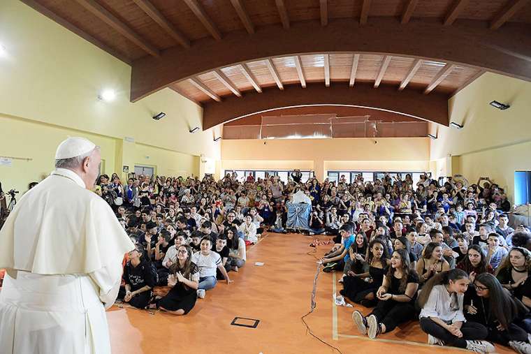 Pope makes surprise visit to school named after book-loving child