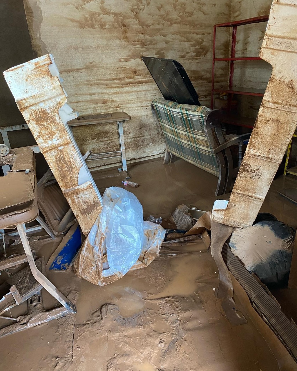 A house is partially destroyed and full of mud in Brumadinho, Brazil. (Credit: Bishop Vicente Ferreira/Facebook.)