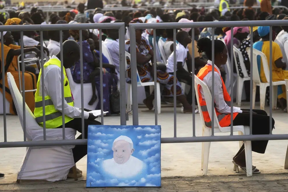 People wait for Pope Francis arrival at John Garang Mausoleum on the occasion of a mass in Juba, South Sudan, Sunday, Feb. 5, 2023. (Credit: Gregorio Borgia/AP.)