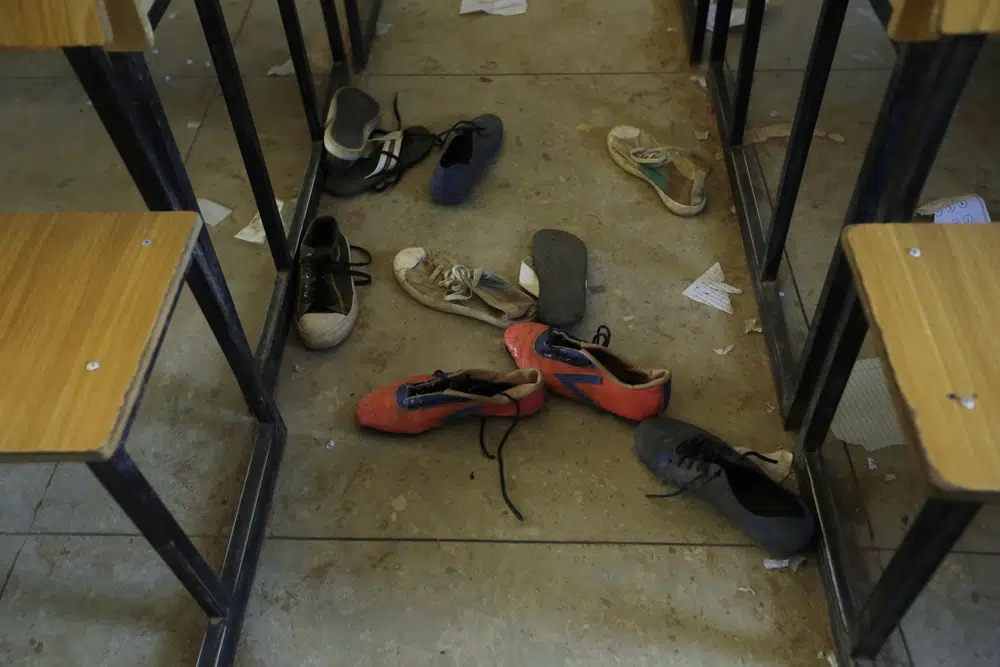 In a file photo, shoes of the kidnapped students from Government Science Secondary School are seen inside their class room Kankara, Nigeria, Wednesday, Dec. 16, 2020. Rebels from the Boko Haram extremist group claimed responsibility. (Credit: Sunday Alamba/AP.)