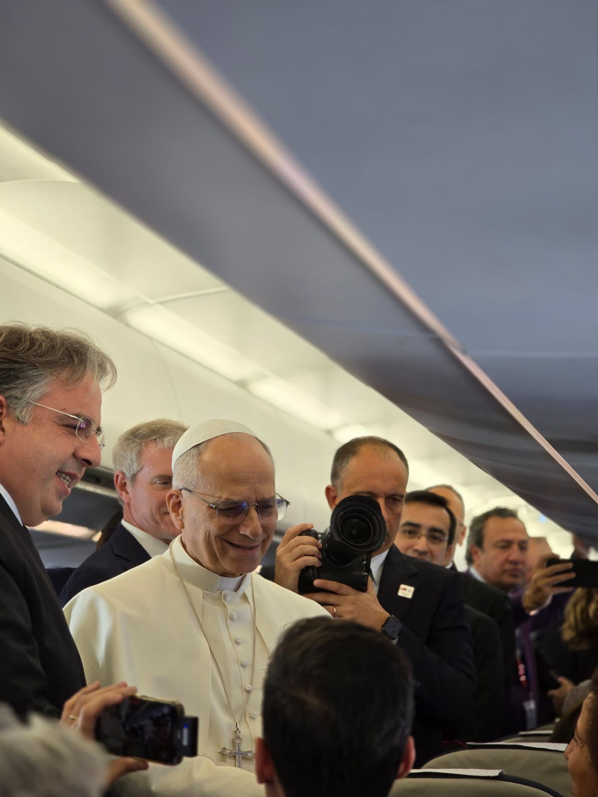 Pope Leo XIV on the papal plane, Nov. 27, 2025. (Credit: Elise Allen/Crux.)