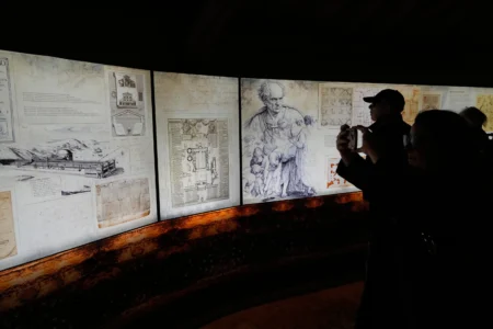 Journalists attend the opening of an exhibition titled "Ultra Visibilia" on the occasion of the 400th anniversary of the dedication of St. Peter's Basilica at the Vatican, Monday, Feb. 16, 2026. (Credit: Gregorio Borgia/AP.)