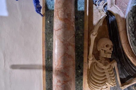 The hand of a restorer peaks from a scaffolding inside the Basilica of San Pietro in Vincoli in Rome, Monday, March 9, 2026. (Credit: Domenico Stinellis/AP.)