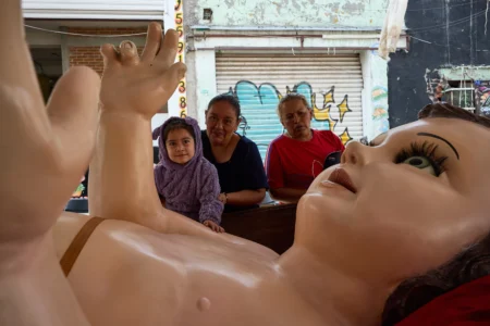 Parishioners take part in an offering to a giant Baby Jesus in Mexico City, Tuesday, March 10, 2026. (Credit: Ginnette Riquelme/AP.)