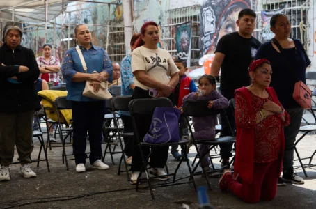 Parishioners pray to a giant Baby Jesus in Mexico City, Tuesday, March 10, 2026. (Credit: Ginnette Riquelme/AP.)