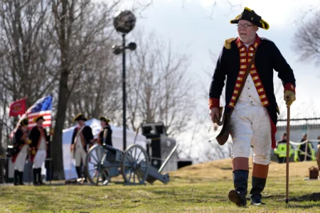 Crane’s Continental Artillery reenactor Jeffrey Cooke takes part in an Evacuation Day ceremony marking the 1776 departure of British troops from the city during the American Revolutionary War, March 17, 2026, in Boston, Massachusetts. (Credit: Robert F. Bukaty/AP.)