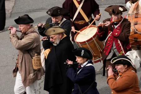 Members of a fife and drum band march in an Evacuation Day ceremony marking the 1776 departure of British troops from the city during the American Revolutionary War, March 17, 2026, in Boston, Massachusetts. (Credit: Robert F. Bukaty/AP.)