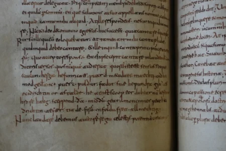 A rare, long-lost copy of Caedmon's Hymn — the first poem ever written down in Old English — is visible in the five lines above the final line of a page from an 8th-century manuscript copy of the Venerable Bede's Ecclesiastical History of the English People, at Rome's National Library, Thursday, May 8, 2026. (Credit: Andrea Rosa/AP.)