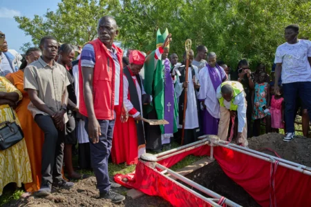 Clergy members and mourners gather during the burial of Tom Ochieng Mima on the outskirts of Kisumu, Kenya, Friday, March 13, 2026. (Credit: Asa Wallin/AP.)