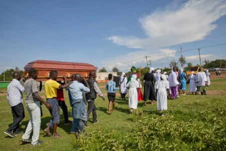 Mourners carry a coffin during a funeral procession led by a Christian congregation on the outskirts of Kisumu, Kenya, Friday, March 13, 2026. (Credit: Asa Wallin/AP.)
