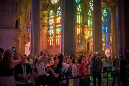 Visitors take photos inside the Basilica of the Sagrada Familia in Barcelona, Spain, Tuesday, May 26, 2026, ahead of Pope Leo XIV's visit to the city in June. (Credit: Emilio Morenatti/AP.)