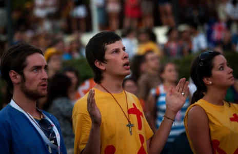 Pilgrims pray in the street during a mass at the Cibeles square in Madrid, Aug. 16, 2011, ahead of the visit of Pope Benedict XVI. (Credit: Emilio Morenatti/AP.)
