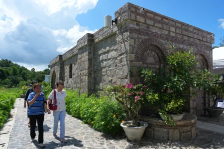 Catholics walk outside the Ephesus House, a replica of the House of the Virgin Mary in Ephesus, Turkey, at Alfonso town, Cavite province, Philippines, on July 16, 2026. (Credit: Aaron Favila/AP.)