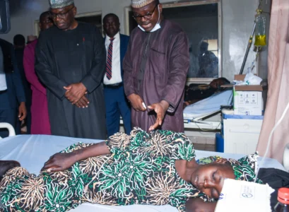 Kwara State Governor Abdulrahman Abdulrazaq visits a woman in a hospital in Ilorin, Nigeria, on Aug. 7, 2026. (Credit: Abubakar Khadijak/AP.)