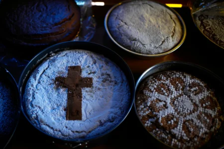 Fanouropites, orange-flavored cakes, are placed on tables to be blessed at the Church of St. Fanourios in Athens, Tuesday, Aug. 25, 2026. (Credit: Thanassis Stavrakis/AP.)