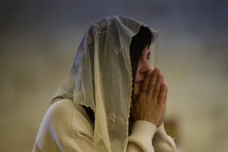 A Christian pilgrim attends a Mass in the Basilica of the Transfiguration on Mount Tabor, northern Israel, Aug. 6, 2026. (Credit: Ariel Schalit/AP.)