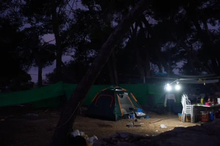Tents of Christian pilgrims who spent overnight in the forest next to the Basilica of the Transfiguration on Mount Tabor, northern Israel, on Aug. 6, 2026. (Credit: Ariel Schalit/AP.)
