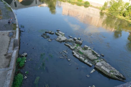 The ruins of the ancient Roman Neronian bridge, emerge from the riverbed of the Tiber river due to drought, in Rome, Thursday, Aug. 13, 2026. (Credit: Gregorio Borgia/AP.)
