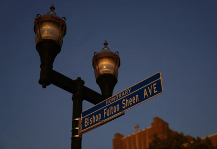 An honorary street sign for the late Archbishop Fulton Sheen stands just outside the Spalding Institute, the former high school Sheen attended, in Peoria, Ill., on July 14, 2026. (Credit: Jessie Wardarski/AP.)